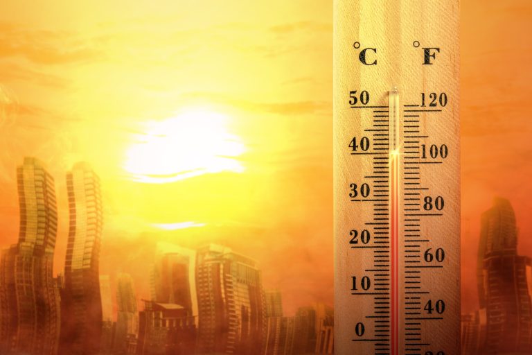 Thermometer,With,High,Temperature,On,The,City,With,Glowing,Sun